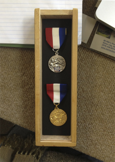 swim meet medals framed by Hot Springs Frame and Art Supply in Truth or Consequences New Mexico