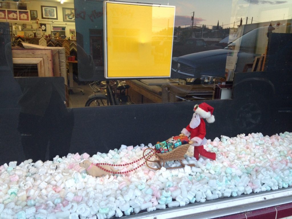 Santa in the window at Hot Springs Frame & Art Supply